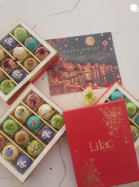Lilac Mithai Studio Instagram post: Diwali gift boxes of assorted mithai with a Happy Diwali card