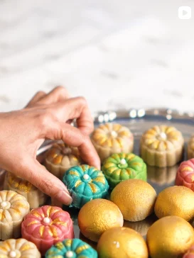 Lilac Mithai Studio Instagram post: Hand picking colourful flower-shaped mithai