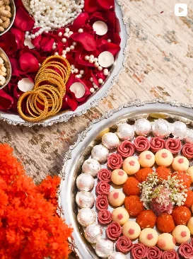 Lilac Mithai Studio Instagram post: Silver platters of rose mithai for a wedding